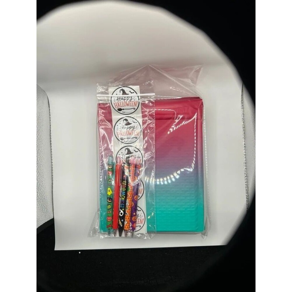 10 pack of pink/ green ombré matte bubble mailers with Halloween stickers and pe